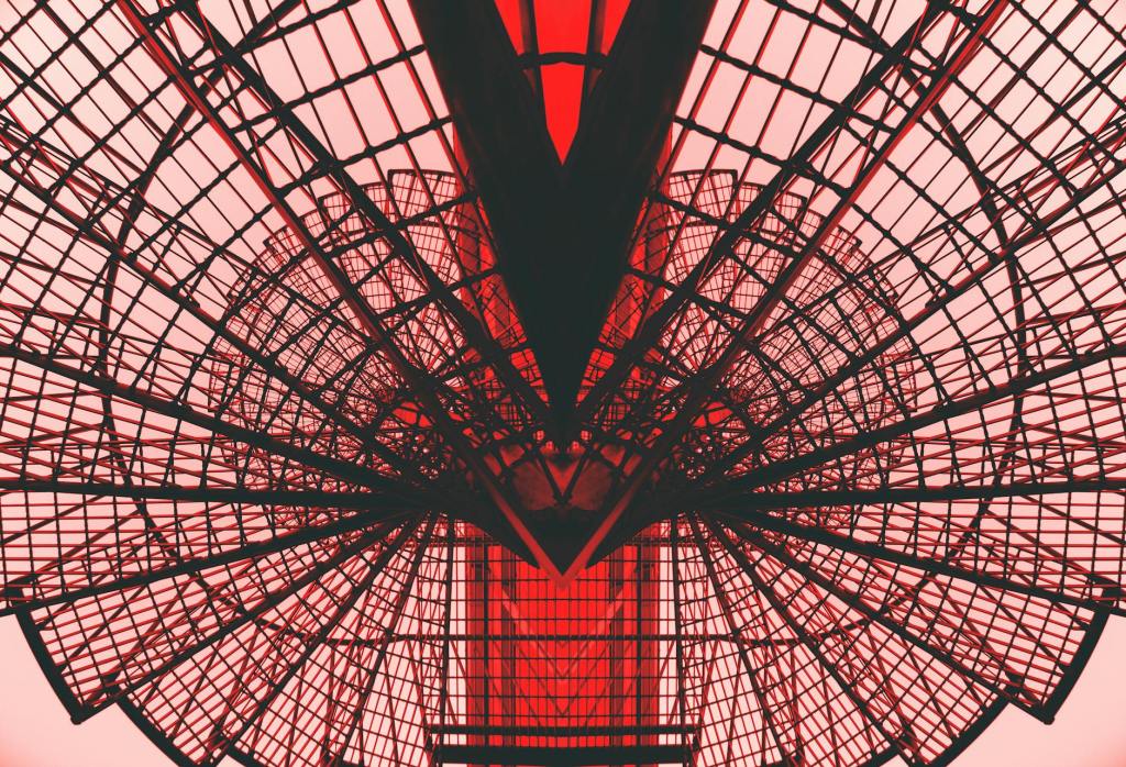 low angle photography of red metal tower