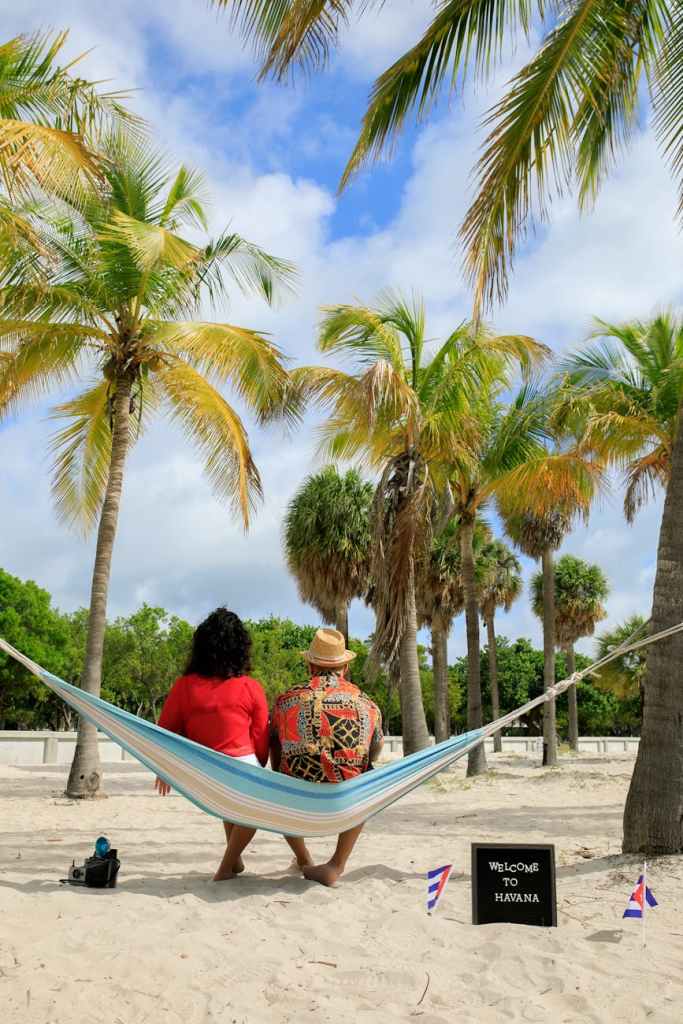 back view of a couple sitting on the hammock