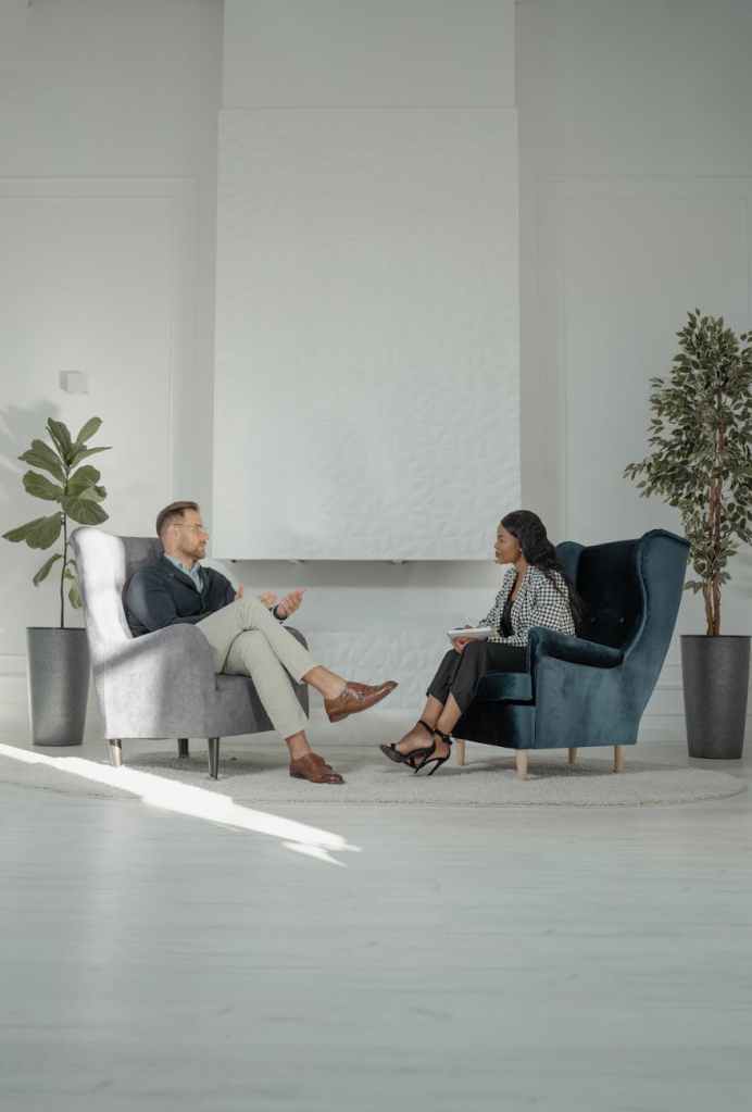 a woman interviewing a man