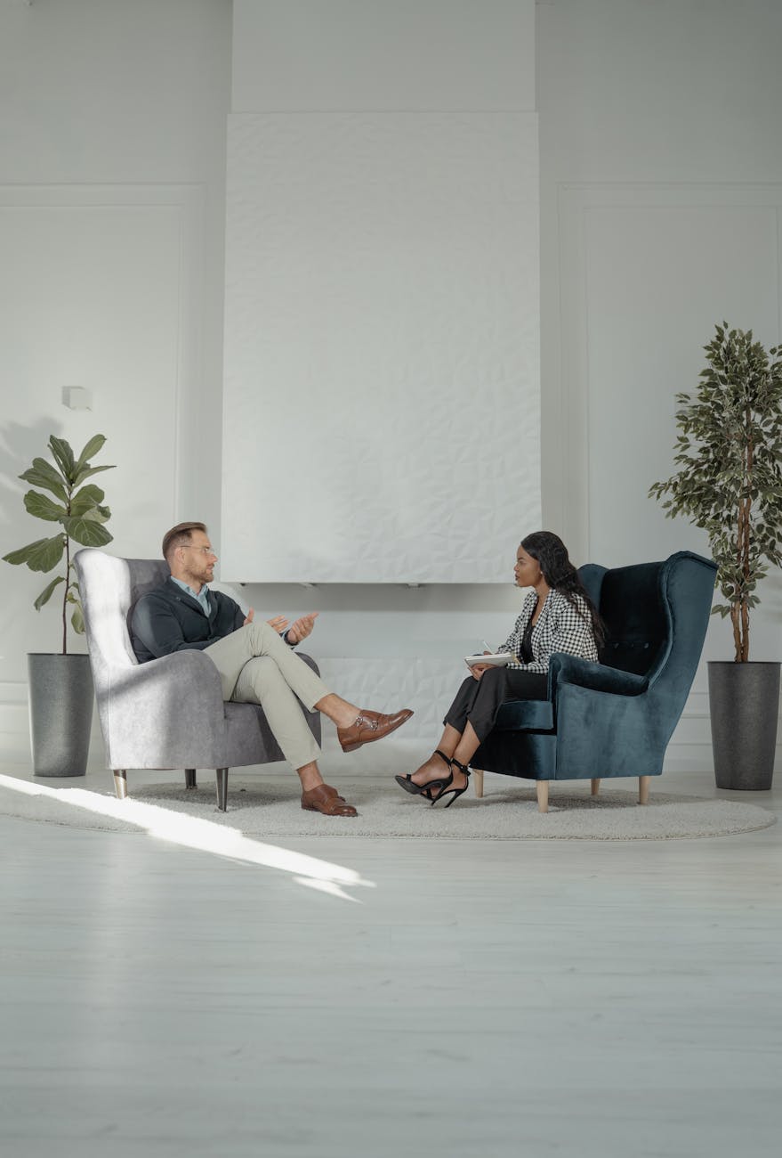 a woman interviewing a man