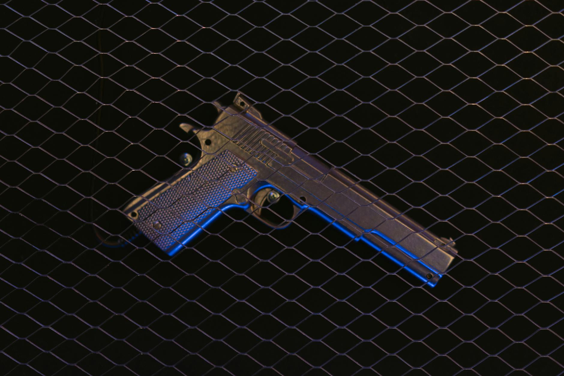 pistol on a black surface