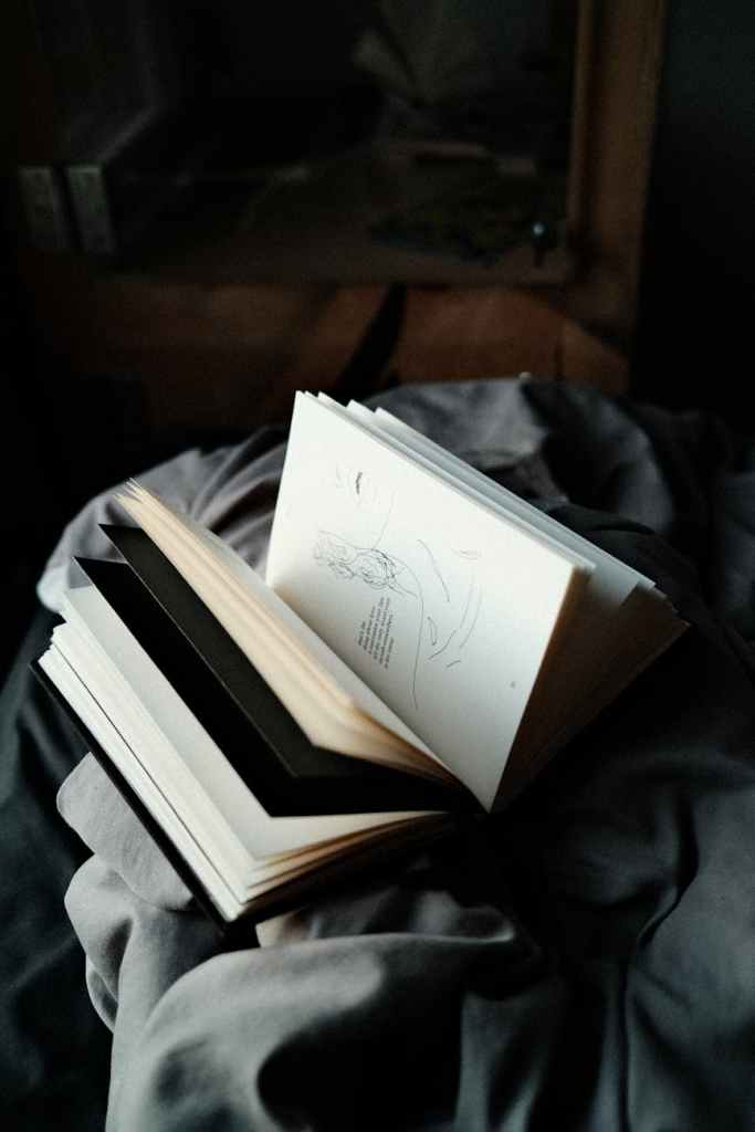 book on top of a gray fabric