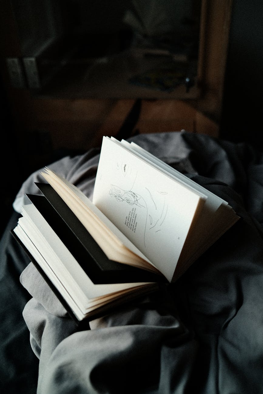 book on top of a gray fabric