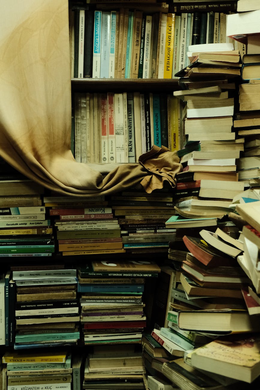 curtain on stacks of old books in shop