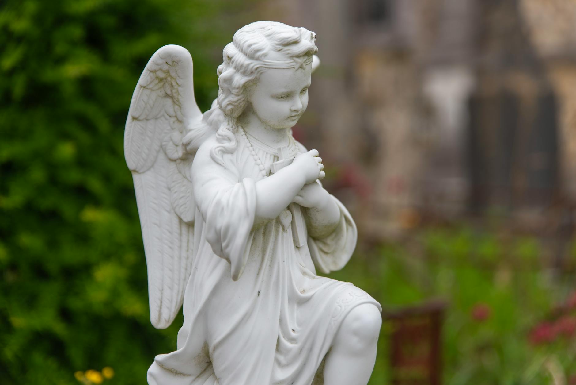 white angel statue in serene outdoor setting