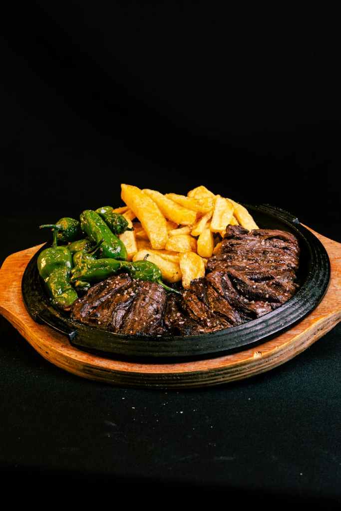 a plate of food with meat and vegetables