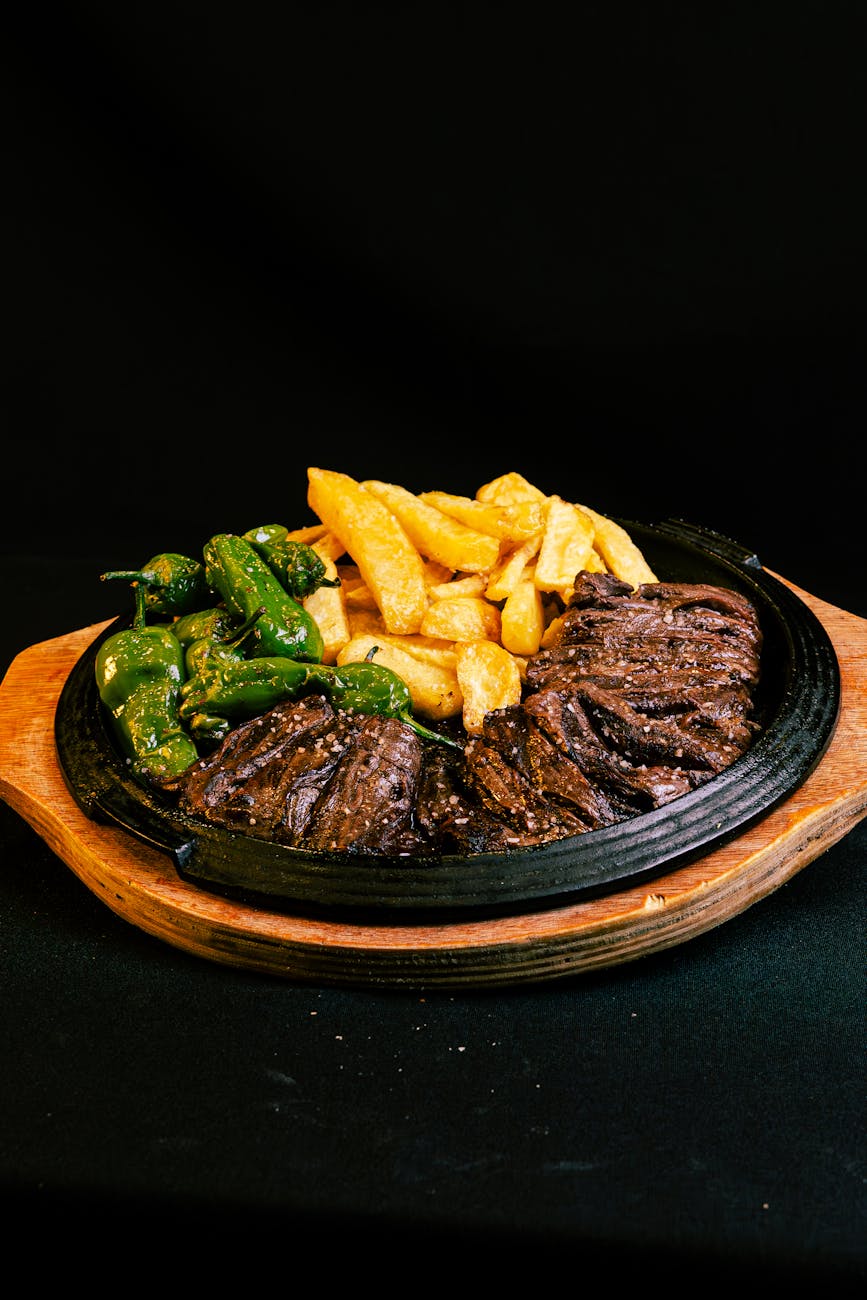 a plate of food with meat and vegetables