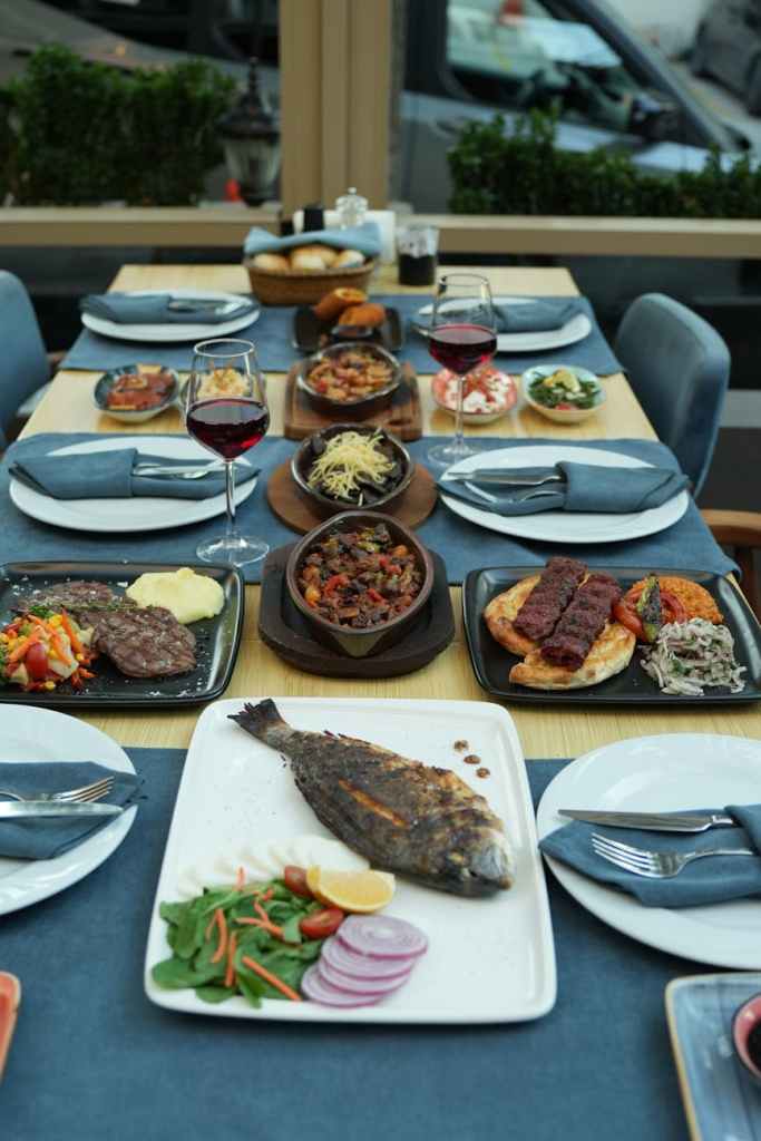 elegant fine dining table set with diverse dishes
