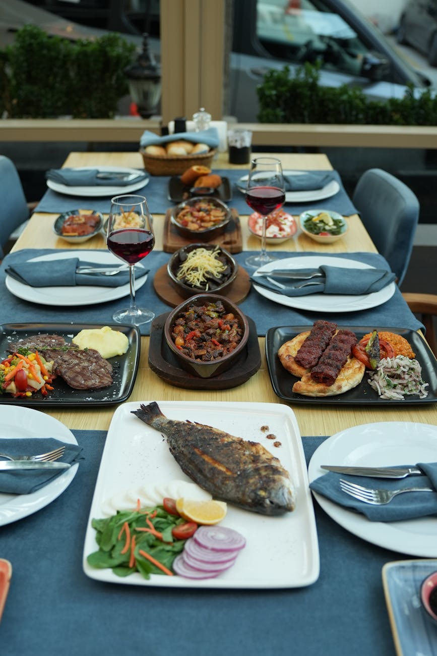 elegant fine dining table set with diverse dishes