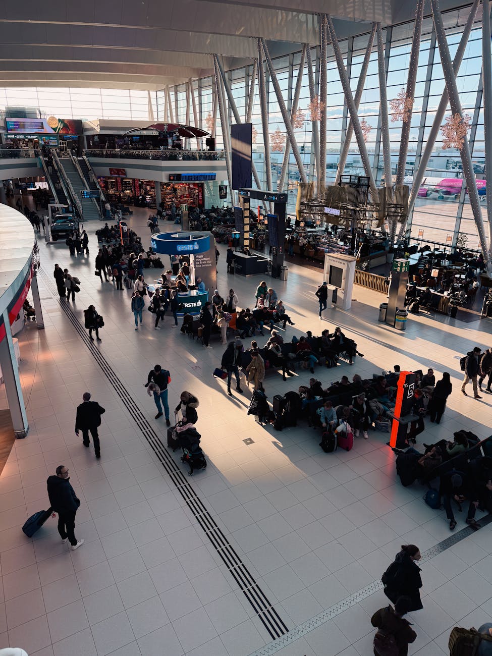 busy airport terminal with passengers awaiting flights