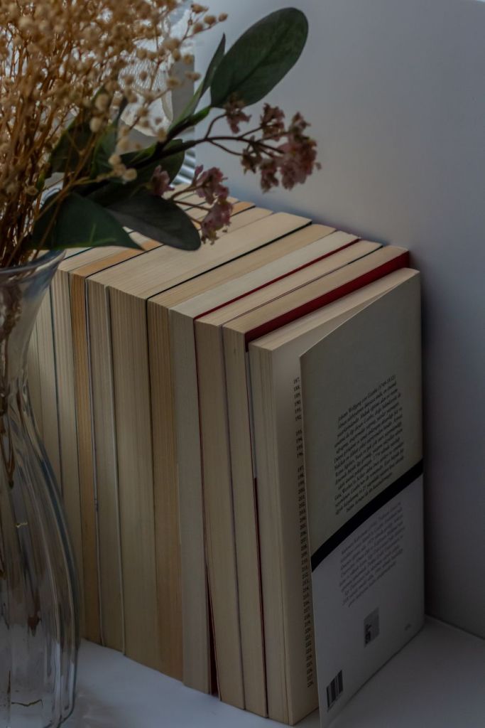 elegant book stack with floral arrangement