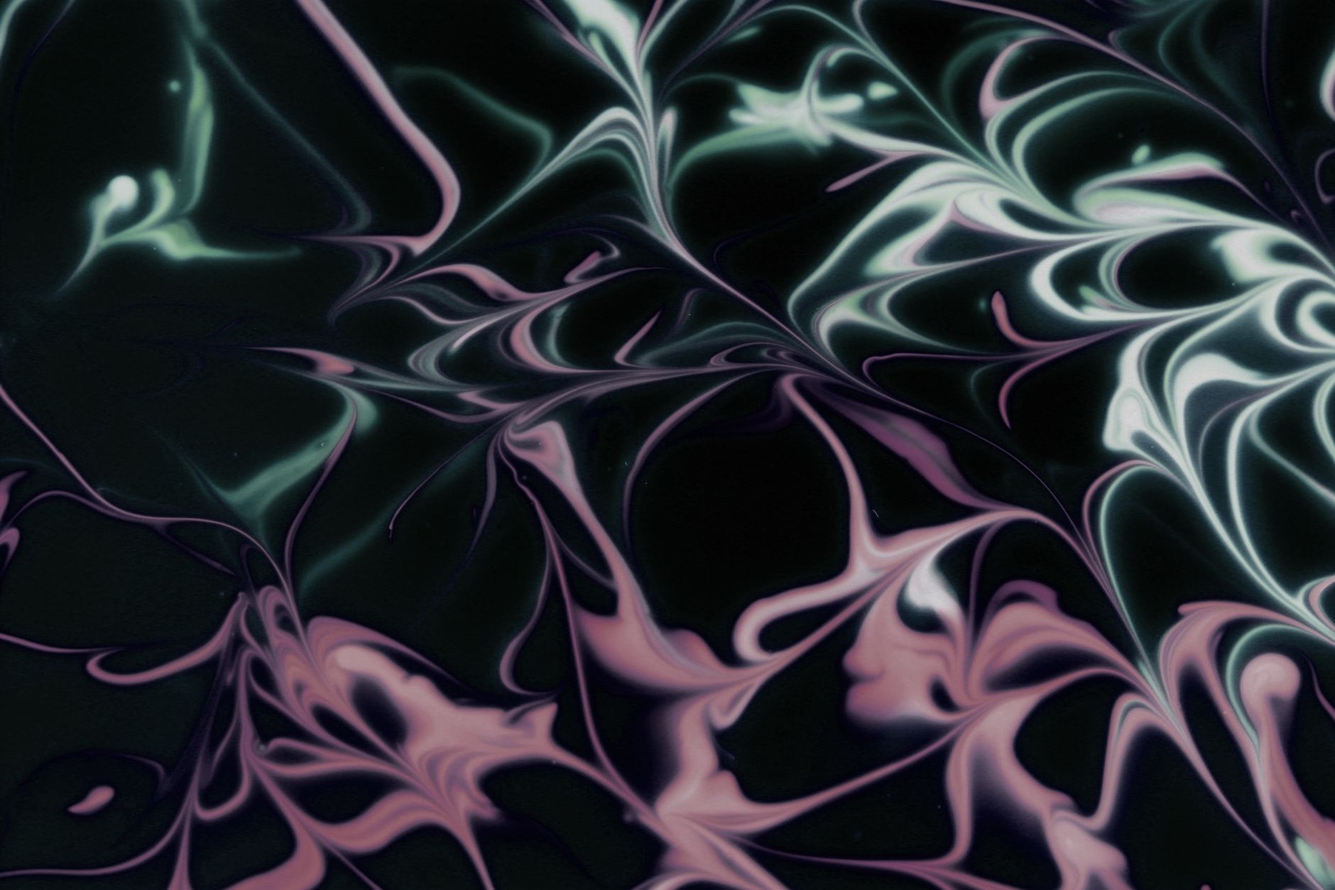 abstract swirling pastel patterns on dark background